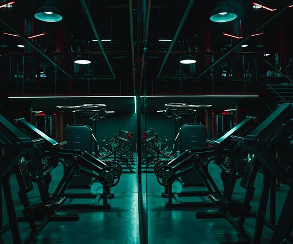 Clean minimalist gym interior with neon lighting.